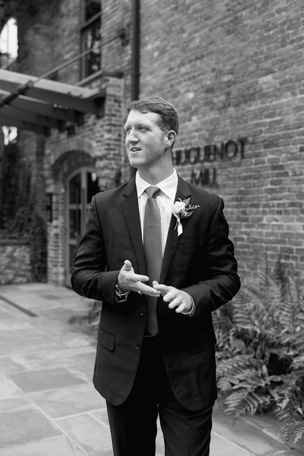 groom portraits outside of a Greenville wedding venue