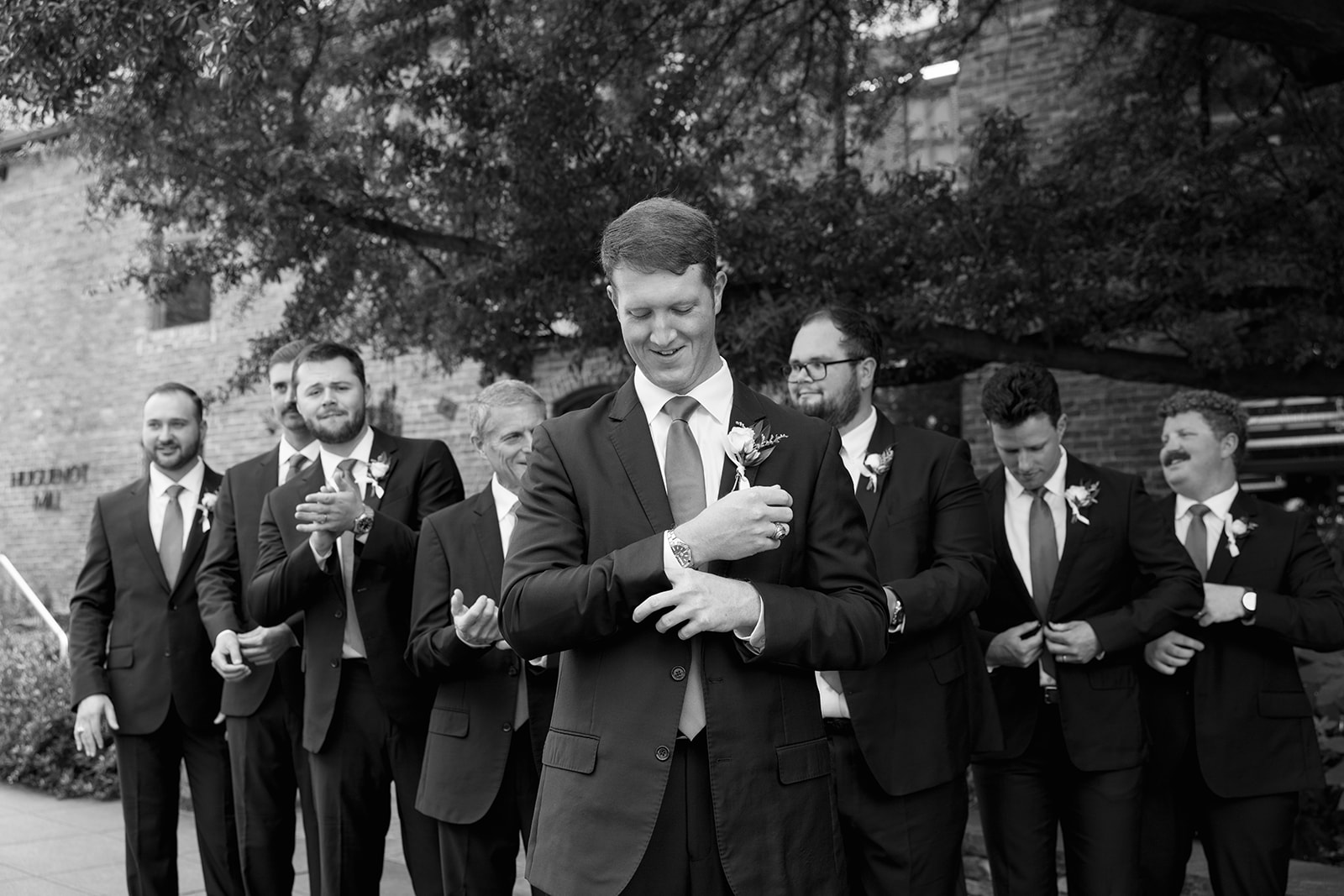 the groom and his groomsmen taking portraits during the Wedding Photography Timeline
