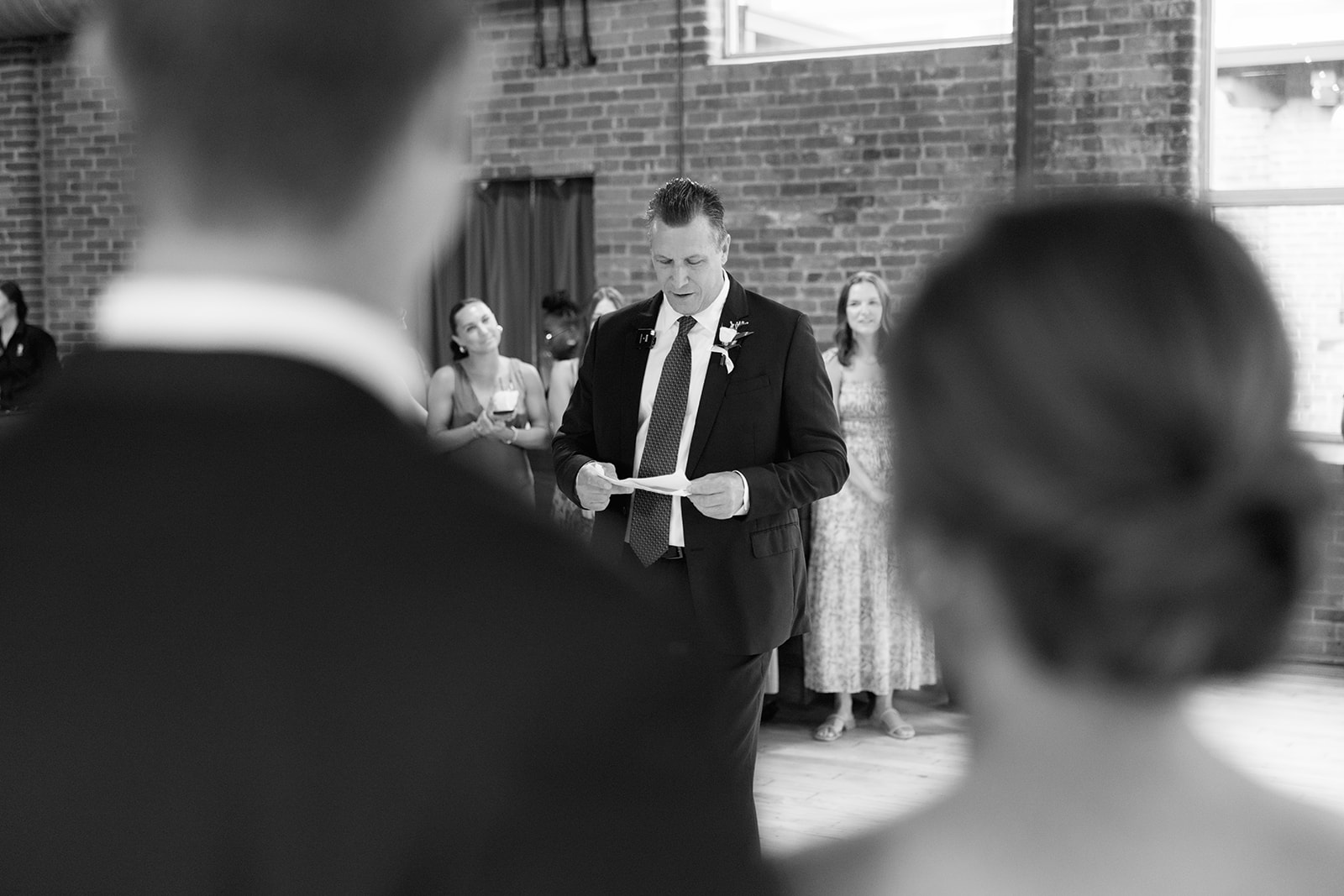 Greenville Wedding Photography of the bride's dad saying a speech 